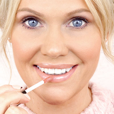 Apply gloss directly to lips & smudge lips together